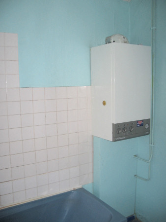 Boiler and old style small white tiles