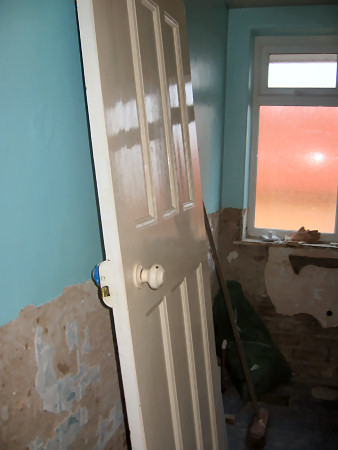 Door off and tiles stripped