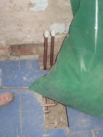 Plumbing to bath laid in