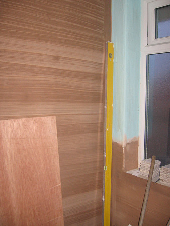 Wall by door plastered ready for tiling