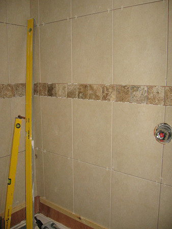 Tiles up in shower enclosure area