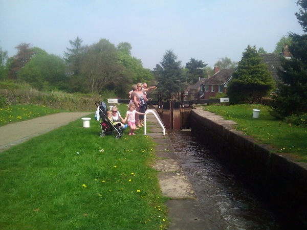 Family standing by canal lock