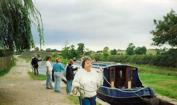 Mum leading boat into a lock