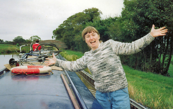 Alison balancing on side of boat